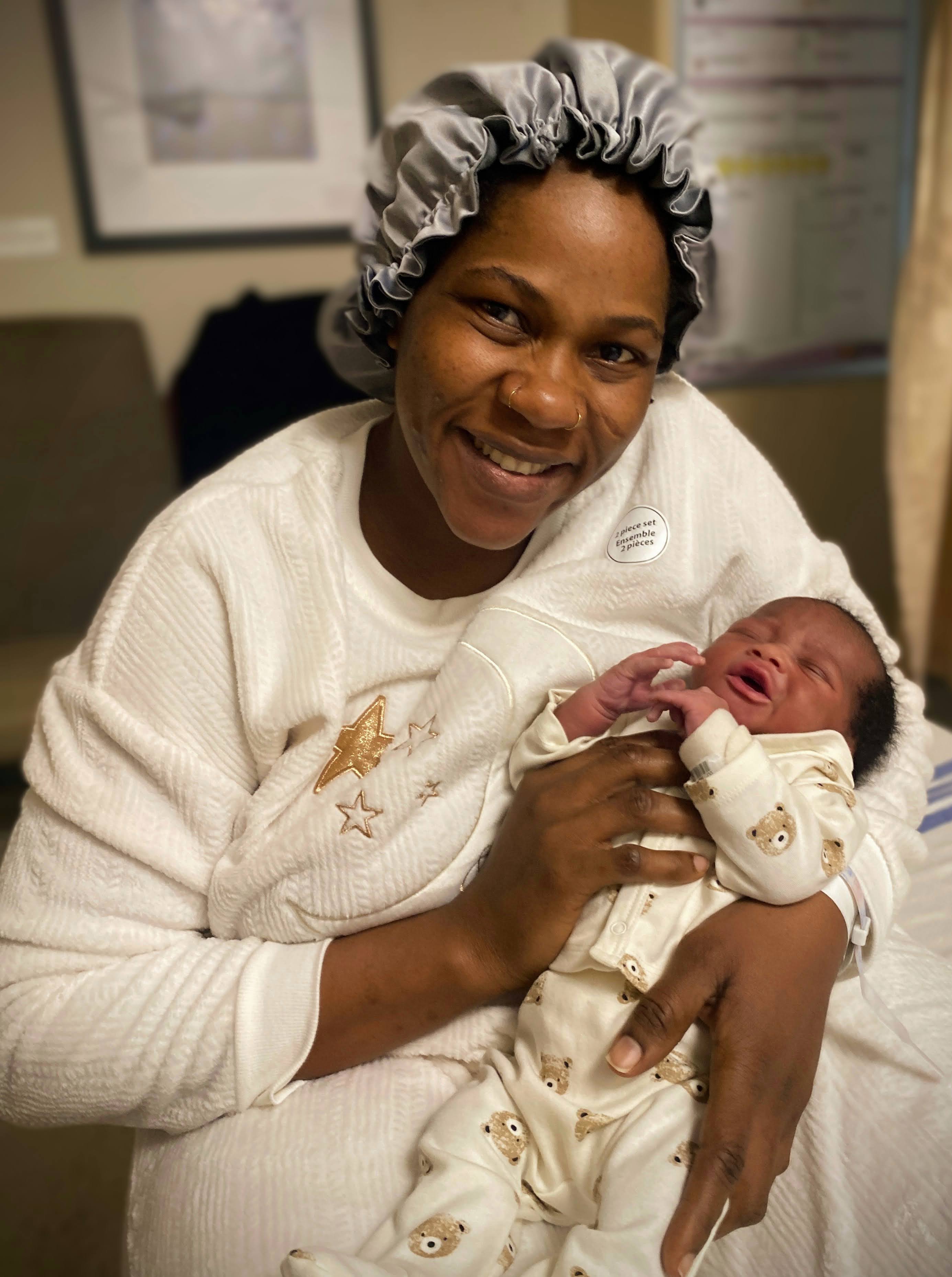 Mother holding baby in warm natural light